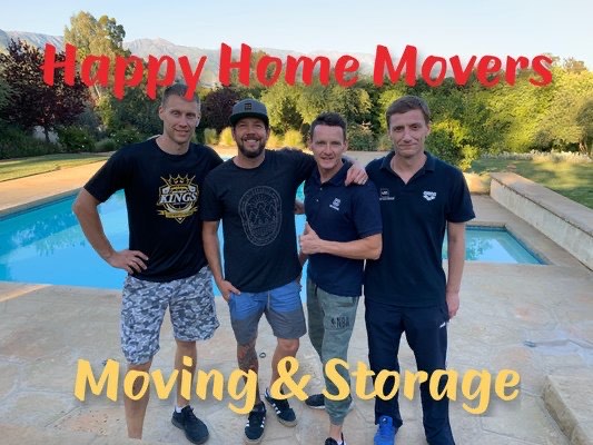 Four Happy Home Moovers team members standing together
