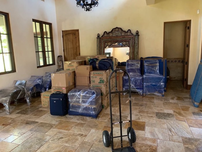 Boxes and furniture carefully packed and wrapped for a Happy Home Moovers relocation